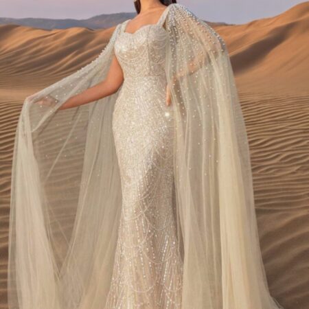 Champagne sequin evening gown with sweetheart neckline, cloak sleeves, and mermaid hem from the Élevé Collection by L13E