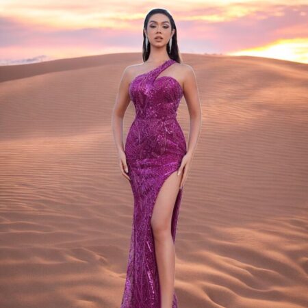 odel wearing a purple one-shoulder sequin gown with a detachable satin overskirt from the Elévé Collection by L13E
