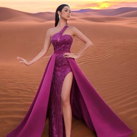 odel wearing a purple one-shoulder sequin gown with a detachable satin overskirt from the Elévé Collection by L13E